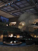 Seating, piano, and hanging sculpture in the lobby.