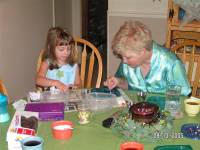 Harley and me doing crafts at 6:30 a.m.!!! ------EVERY morning they stayed (Friday, Saturday, and Sunday)  Glueing beads on just about everything.  