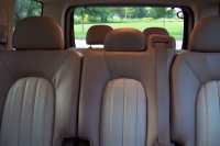 The middle second row seat opens with storage under the seat.