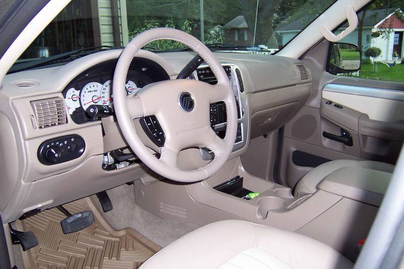 Front with my generic vinyl mats I put in.  Metallic/pewter trim on doors and dashboard.
