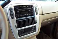 Radio & CD player.  The three buttons to the left, "Info, Setup, and Reset" is the onboard message center that appears on the dash.  It tells # miles to empty, gas miles per gallon, temp outside and direction going, trip miles...I think that's all.  ???   Duel control heat and AC.  The driver can have a different temp than the passenger!